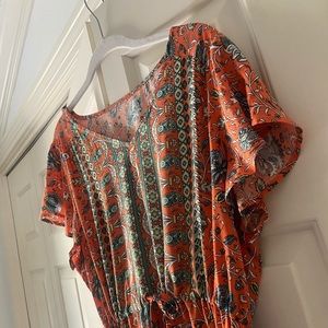 Orange patterned tiered dress with slit